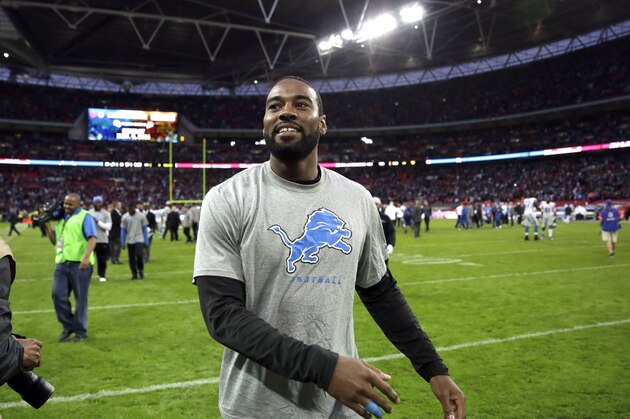 Detroit Lions wide receiver Calvin Johnson celebrates after the NFL football game against the Atlanta Falcons at Wembley Stadium, London, Sunday, Oct. 26, 2014. The Lions won 22-21. (AP Photo/Matt Dunham)