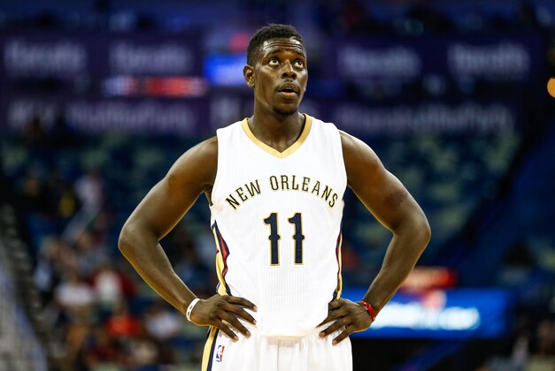 Oct 16, 2014; New Orleans, LA, USA; New Orleans Pelicans guard Jrue Holiday (11) against the Oklahoma City Thunder during a preseason game at the Smoothie King Center. The Pelicans defeated the Thunder 120-86. Mandatory Credit: Derick E. Hingle-USA TODAY Sports