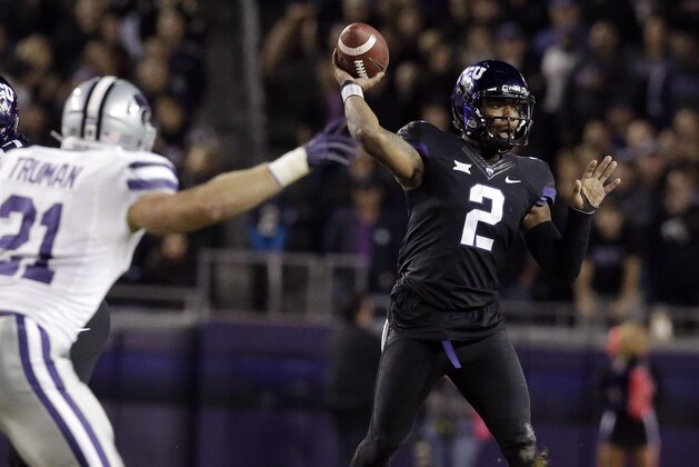 DTCU quarterback Trevone Boykin (2) passes as Kansas State linebacker Jonathan Truman (21) reaches in during the first quarter of an NCAA college football game Saturday, Nov. 8, 2014, in Fort Worth, Texas. (AP Photo/LM Otero)