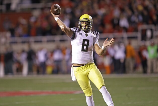 Oregon quarterback Marcus Mariota (8) passes the ball in the second half during an NCAA college football game against Utah Saturday, Nov. 8, 2014, in Salt Lake City. (AP Photo/Rick Bowmer)