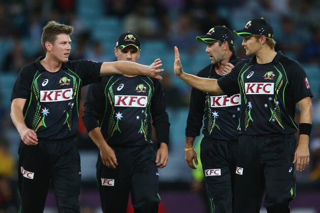 SYDNEY, AUSTRALIA - NOVEMBER 09:  James Faulkner, Aaron Finch, Glenn Maxwell and Shane Watson of Australia celebrate after a wicket during game three of the Men's International Twenty20 series between Australia and South Africa at ANZ Stadium on November 9, 2014 in Sydney, Australia.  (Photo by Mark Kolbe/Getty Images)