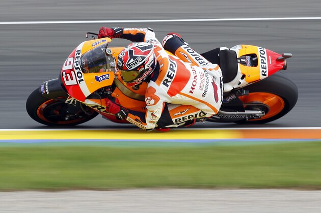 Moto GP rider Marc Marquez of Spain rides his motorbike during free practice at Spain's Valencia Motorcycle Grand Prix, the last race of the season, at the Ricardo Tormo circuit in Cheste near Valencia, Spain, Saturday Nov. 8, 2014. (AP Photo/Alberto Saiz)