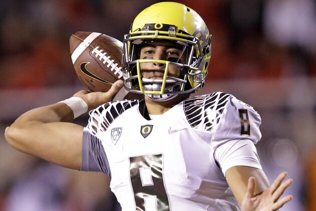 Oregon quarterback Marcus Mariota (8) passes the ball in the second half during an NCAA college football game against Utah Saturday, Nov. 8, 2014, in Salt Lake City. (AP Photo/Rick Bowmer)