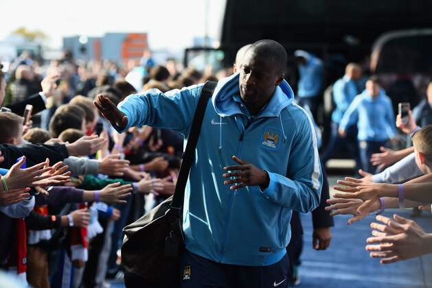 MANCHESTER, ENGLAND - NOVEMBER 02: Yaya Toure of Manchester City arrives for the Barclays Premier League match between Manchester City and Manchester United at Etihad Stadium on November 2, 2014 in Manchester, England.  (Photo by Laurence Griffiths/Getty Images)