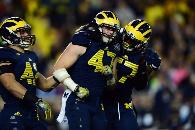 Oct 11, 2014; Ann Arbor, MI, USA; Michigan Wolverines linebacker Jake Ryan (47) celebrates with teammates after a sack during the third quarter against the Penn State Nittany Lions at Michigan Stadium. Mandatory Credit: Andrew Weber-USA TODAY Sports