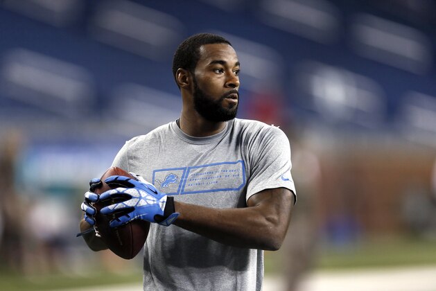Detroit Lions wide receiver Calvin Johnson catches a ball during warmups before a NFL football game against the Miami Dolphins in Detroit Sunday, Nov. 9, 2014.  (AP Photo/Paul Sancya)