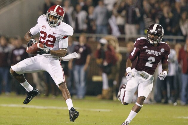 Alabama wide receiver Christion Jones (22) pulls down a third-quarter pass reception in front of Mississippi State defensive back Will Redmond (2) during an NCAA college football game, Saturday, Nov. 16, 2013, in Starkville, Miss. (AP Photo/Butch Dill)