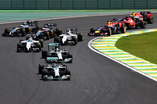 SAO PAULO, BRAZIL - NOVEMBER 09:  Nico Rosberg of Germany and Mercedes GP leads Lewis Hamilton of Great Britain and Mercedes GP and the field during the Brazilian Formula One Grand Prix at Autodromo Jose Carlos Pace on November 9, 2014 in Sao Paulo, Brazil.  (Photo by Paul Gilham/Getty Images)