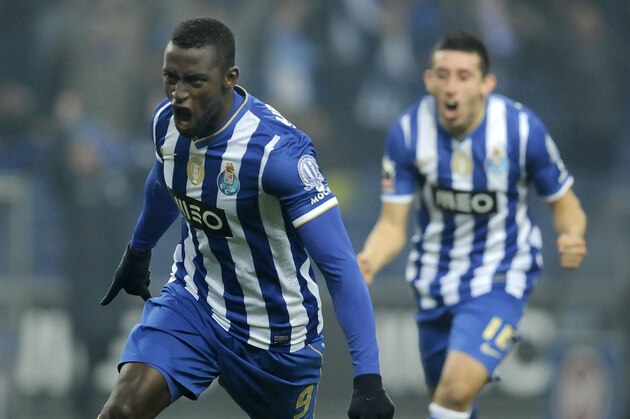 FC Porto's Jackson Martinez, from Colombia, celebrates with Hector Herrera from Mexico, rear, after scoring the opening goal against Sporting Braga in a Portuguese League soccer match at the Dragao Stadium in Porto, Portugal, Saturday, Dec. 7, 2013. (AP Photo/Paulo Duarte)