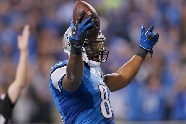 DETROIT, MI - NOVEMBER 09: Calvin Johnson #81 of the Detroit Lions celebrates a first quarter touchdown while playing the Miami Dolphins at Ford Field on November 09 , 2014 in Detroit, Michigan. (Photo by Leon Halip/Getty Images)