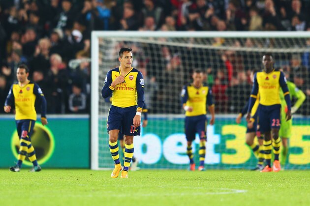 SWANSEA, WALES - NOVEMBER 09:  Alexis Sanchez of Arsenal (17) and team mates look dejected as they concede a goal during the Barclays Premier League match between Swansea City and Arsenal at Liberty Stadium on November 9, 2014 in Swansea, Wales.  (Photo by Michael Steele/Getty Images)