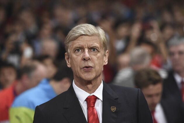 Arsenal's coach Arsene Wenger looks on during the Champions League Group D soccer match between Arsenal  and Galatasaray , at the Emirates Stadium in London, on Wednesday, Oct 1, 2014. (AP Photo/ Tim Ireland)