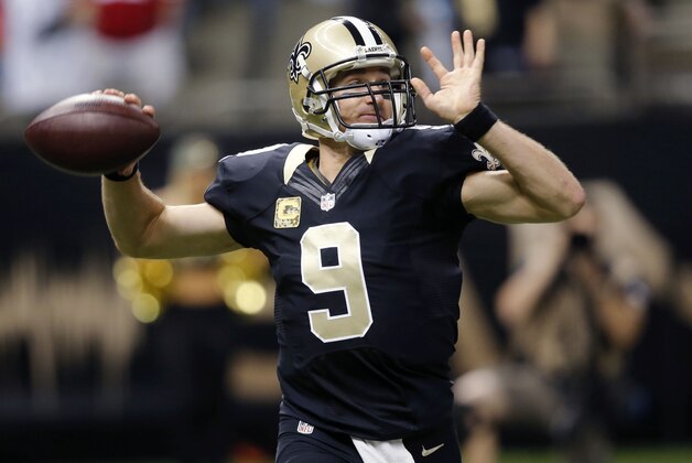 New Orleans Saints quarterback Drew Brees (9) drops back to pass in the first half of an NFL football game in New Orleans, Sunday, Nov. 9, 2014. (AP Photo/Bill Haber)