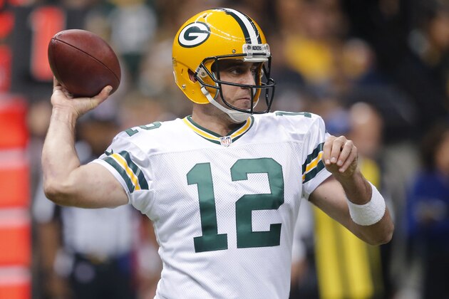Green Bay Packers quarterback Aaron Rodgers (12) passes in the first half of an NFL football game against the New Orleans Saints in New Orleans, Sunday, Oct. 26, 2014. (AP Photo/Bill Haber)