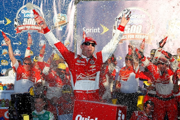AVONDALE, AZ - NOVEMBER 09:  Kevin Harvick, driver of the #4 Budweiser Chevrolet, celebrates in victory lane after winning the NASCAR Sprint Cup Series Quicken Loans Race for Heroes 500 at Phoenix International Raceway on November 9, 2014 in Avondale, Arizona.  (Photo by Tom Pennington/Getty Images)