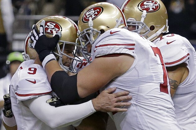San Francisco 49ers kicker Phil Dawson (9) is congratulated by tackle Joe Staley (74) after kicking the game winning field goal in overtime of an NFL football game against the New Orleans Saints in New Orleans, Sunday, Nov. 9, 2014. The San Francisco 49ers won 27-24. (AP Photo/Jonathan Bachman)