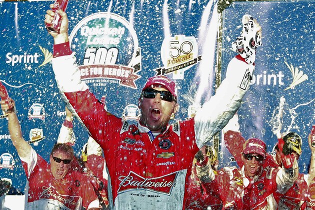 Kevin Harvick celebrates in Victory Lane after winning the NASCAR Sprint Cup series auto race at Phoenix International Raceway, Sunday, Nov. 9, 2014, in Avondale, Ariz. (AP Photo/Ralph Freso)