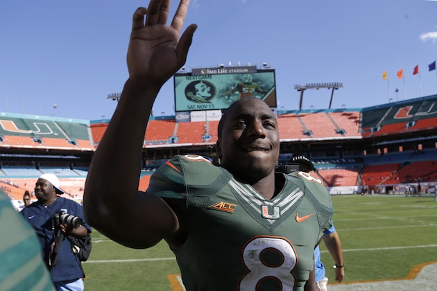 Miami running back Duke Johnson (8) waves as he leaves the field after an NCAA football game against North Carolina, Saturday, Nov. 1, 2014, in Miami Gardens, Fla. Miami defeated North Carolina 47-20. (AP Photo/Lynne Sladky)
