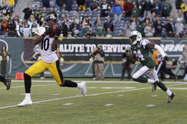 Pittsburgh Steelers wide receiver Martavis Bryant (10) catches a pass for in front of Phillip Adams (24) during the second half of an NFL football game, Sunday, Nov. 9, 2014, in East Rutherford, N.J. Bryant scored a touchdown on the play. (AP Photo/Kathy Willens)