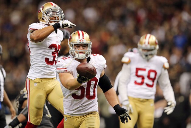 Nov 9, 2014; New Orleans, LA, USA; San Francisco 49ers inside linebacker Chris Borland (50) celebrates after a fumble by New Orleans Saints quarterback Drew Brees (not pictured) in overtime at Mercedes-Benz Superdome. The 49ers won 27-24. Mandatory Credit: Chuck Cook-USA TODAY Sports