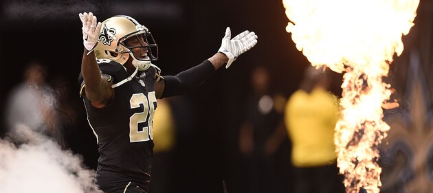 NEW ORLEANS, LA - OCTOBER 26:  Keenan Lewis #28 of the New Orleans Saints runs onto the field at the start of the game against the Green Bay Packers at Mercedes-Benz Superdome on October 26, 2014 in New Orleans, Louisiana.  (Photo by Stacy Revere/Getty Images)
