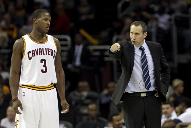 Cleveland Cavaliers head coach David Blatt instructs Dion Waiters (3) in a preseason exhibition basketball game against Maccabi Tel Aviv Sunday, Oct. 5, 2014, in Cleveland. (AP Photo/Mark Duncan)