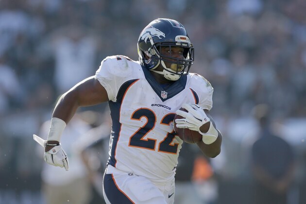 OAKLAND, CA - NOVEMBER 09:  C.J. Anderson #22 of the Denver Broncos carries for a touchdown in the first half against the Oakland Raiders at O.co Coliseum on November 9, 2014 in Oakland, California.  (Photo by Ezra Shaw/Getty Images)