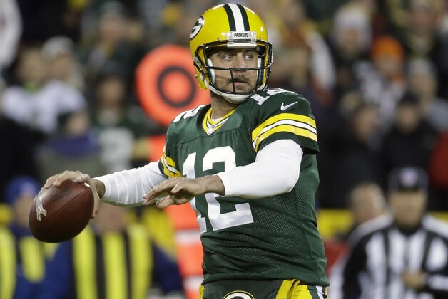 Green Bay Packers quarterback Aaron Rodgers (12) throws a pass during the first half of an NFL football game against the Chicago Bears Sunday, Nov. 9, 2014, in Green Bay, Wis. (AP Photo/Morry Gash)