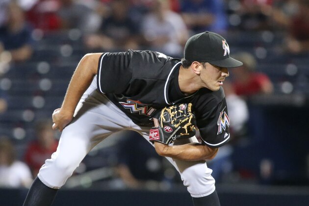 Miami Marlins relief pitcher Steve Cishek (31) prepares to deliver a pitch in the ninth inning of a baseball game against the Atlanta Braves, Saturday, Aug. 30, 2014, in Atlanta. The Marlins won 4-0. (AP Photo/Jason Getz)