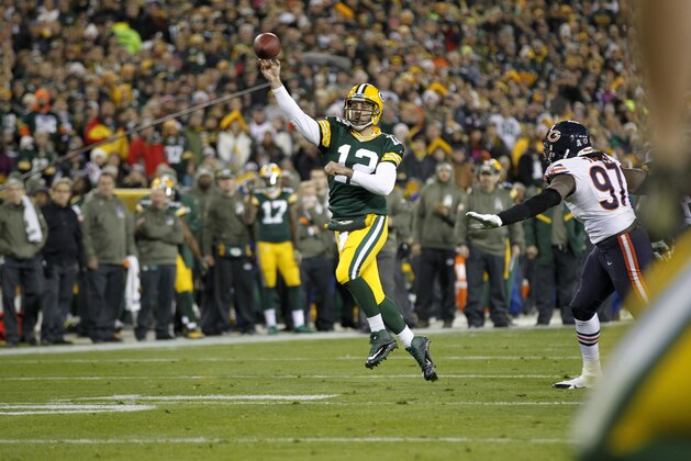Green Bay Packers quarterback Aaron Rodgers (12) throws a pass during the first half of an NFL football game against the Chicago Bears Sunday, Nov. 9, 2014, in Green Bay, Wis. (AP Photo/Mike Roemer)