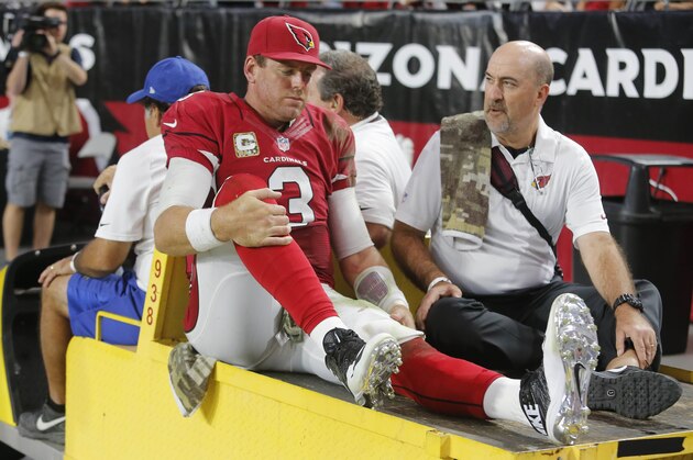 Arizona Cardinals quarterback Carson Palmer (3) leaves the game after being injured against the St. Louis Rams during the second half of an NFL football game, Sunday, Nov. 9, 2014, in Glendale, Ariz. (AP Photo/Rick Scuteri)