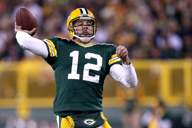 GREEN BAY, WI - NOVEMBER 09:  Quarterback Aaron Rodgers #12 of the Green Bay Packers throws 73 yards for a touchdown against the Chicago Bears in the second quarter at Lambeau Field on November 9, 2014 in Green Bay, Wisconsin.  (Photo by Jonathan Daniel/Getty Images)