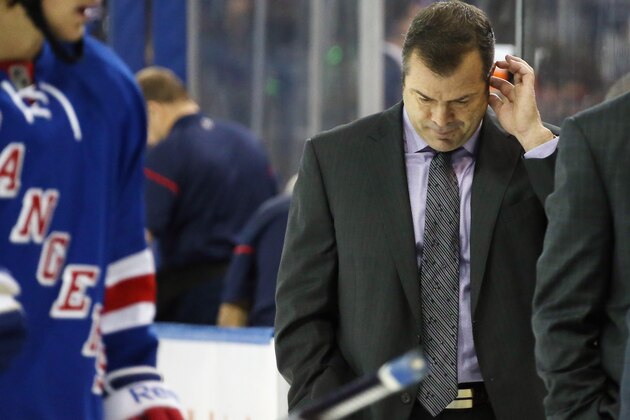 NEW YORK, NY - NOVEMBER 09: Head coach Alain Vigneault of the New York Rangers leaves the ice following a 3-1 loss to the Edmonton Oilers at Madison Square Garden on November 9, 2014 in New York City.  (Photo by Bruce Bennett/Getty Images)