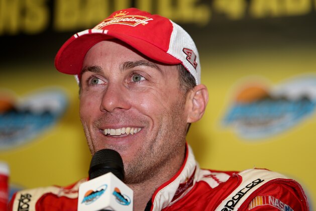 AVONDALE, AZ - NOVEMBER 09:  Kevin Harvick, driver of the #4 Budweiser Chevrolet, speaks to the media after winning the NASCAR Sprint Cup Series Quicken Loans Race for Heroes 500 at Phoenix International Raceway and advancing to the championship round of the Chase for the Sprint Cup on November 9, 2014 in Avondale, Arizona.  (Photo by Todd Warshaw/Getty Images)