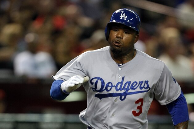 Los Angeles Dodgers left fielder Carl Crawford (3) scores in the fourth inning during a baseball game against the Arizona Diamondbacks, Tuesday, Aug. 26, 2014, in Phoenix. (AP Photo/Rick Scuteri)