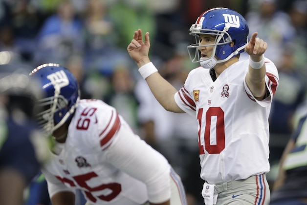 New York Giants quarterback Eli Manning calls to his in the second half of an NFL football game against the Seattle Seahawks, Sunday, Nov. 9, 2014, in Seattle. (AP Photo/Scott Eklund)