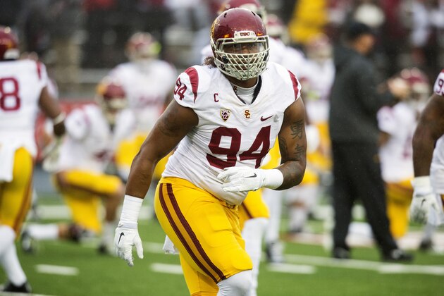 Southern California defensive end Leonard Williams (94) stretches during warmups before the start of an NCAA college football game against Washington State on Saturday, Nov. 1, 2014, at Martin Stadium in Pullman, Wash. Southern California won 44-17. (AP Photo/Dean Hare)