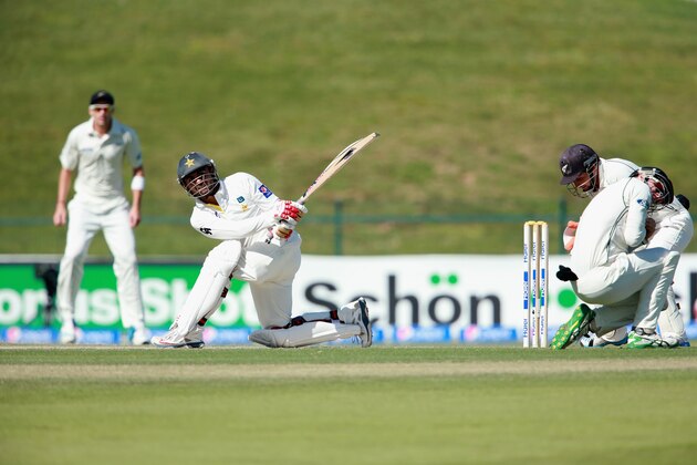 ABU DHABI, UNITED ARAB EMIRATES - NOVEMBER 10:  Ahmed Shehzad of Pakistan sweeps the ball to the boundry during day two of the first test between Pakistan and New Zealand at Sheikh Zayed stadium on November 10, 2014 in Abu Dhabi, United Arab Emirates.  (Photo by Warren Little/Getty Images)