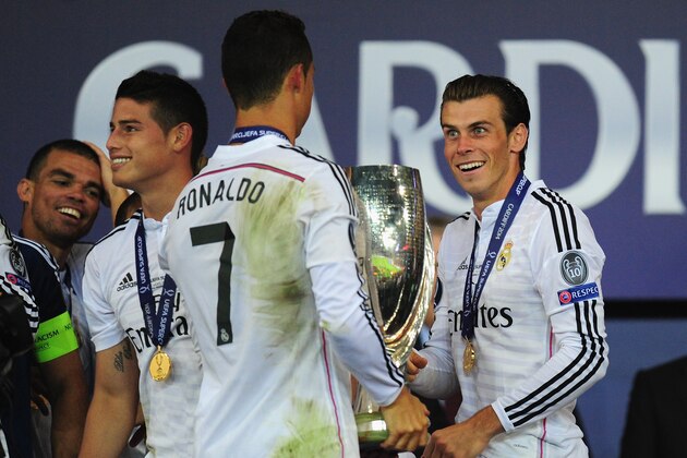 CARDIFF, WALES - AUGUST 12:  Real Madrid players James Rodriguez (l) Ronaldo and Gareth Bale (r) share a joke after the UEFA Super Cup match between Real Madrid and Sevilla FC  at Cardiff City Stadium on August 12, 2014 in Cardiff, Wales.  (Photo by Stu Forster/Getty Images)