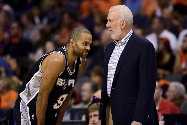 Oct 31, 2014; Phoenix, AZ, USA; San Antonio Spurs head coach Gregg Popovich talks with guard Tony Parker (9) against the Phoenix Suns in the first half at US Airways Center. Mandatory Credit: Jennifer Stewart-USA TODAY Sports
