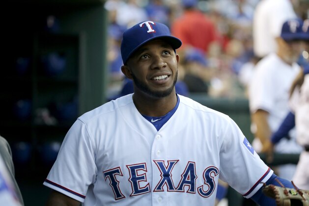 Texas Rangers' Elvis Andrus smiles as he walks through the dugout before a baseball game against the Houston Astros, Tuesday, Sept. 23, 2014, in Arlington, Texas. (AP Photo/Tony Gutierrez)