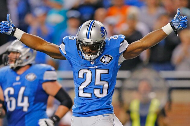 DETROIT, MI - NOVEMBER 09: Theo Riddick #25 of the Detroit Lions celebrates after scoring the game winning score on a 11 yard pass from Matthew Stafford (not in photo) during the fourth quarter of the game against the Miami Dolphins at Ford Field on November 09 , 2014 in Detroit, Michigan. The Lions defeated the Dolphins 20-16. (Photo by Leon Halip/Getty Images)