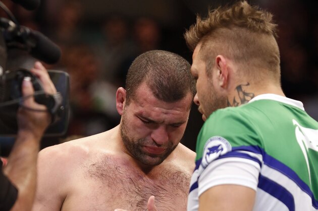 Mauricio 'Shogun' Rua is consoled by his cornerman after losing to Chael Sonnen in their UFC on Fox Sports 1 mixed martial arts light heavyweight bout in Boston, Saturday, August 17,2013.  Sonnen won via first round tapout via guillotine choke. (AP Photo/Gregory Payan)