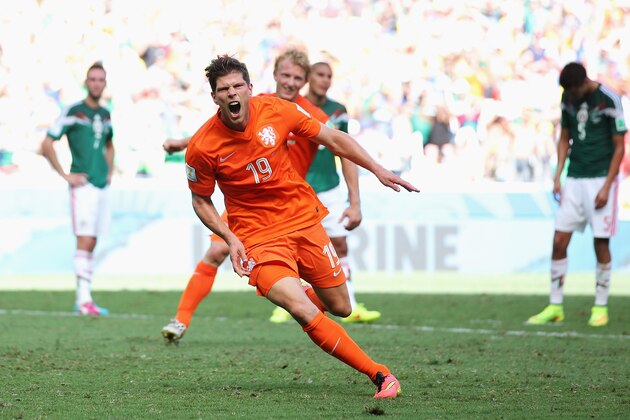 FORTALEZA, BRAZIL - JUNE 29:  Klaas-Jan Huntelaar of the Netherlands celebrates scoring his team's second goal on a penalty kick in stoppage time during the 2014 FIFA World Cup Brazil Round of 16 match between Netherlands and Mexico at Castelao on June 29, 2014 in Fortaleza, Brazil.  (Photo by Dean Mouhtaropoulos/Getty Images)