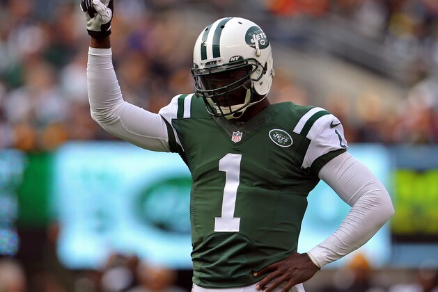 Nov 9, 2014; East Rutherford, NJ, USA; New York Jets quarterback Michael Vick (1) reacts against the Pittsburgh Steelers during the first quarter at MetLife Stadium. Mandatory Credit: Adam Hunger-USA TODAY Sports