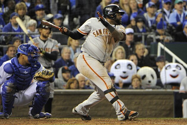Oct 29, 2014; Kansas City, MO, USA; San Francisco Giants third baseman Pablo Sandoval hits a double in the 8th inning against the Kansas City Royals during game seven of the 2014 World Series at Kauffman Stadium. Mandatory Credit: John Rieger-USA TODAY Sports