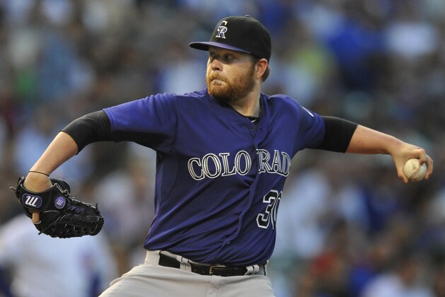 Colorado Rockies starter Brett Anderson delivers a pitch during the first inning of a baseball game agains the Chicago Cubs in Chicago, Wednesday, July 30, 2014. (AP Photo/Paul Beaty)