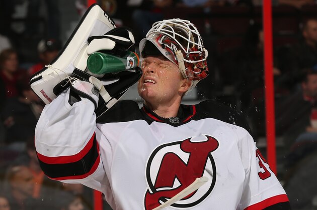 OTTAWA, ON - OCTOBER 25: Cory Schneider #35 of the New Jersey Devils takes a water break in a game against the Ottawa Senators at Canadian Tire Centre on October 25, 2014 in Ottawa, Ontario, Canada.  (Photo by Andre Ringuette/NHLI via Getty Images)