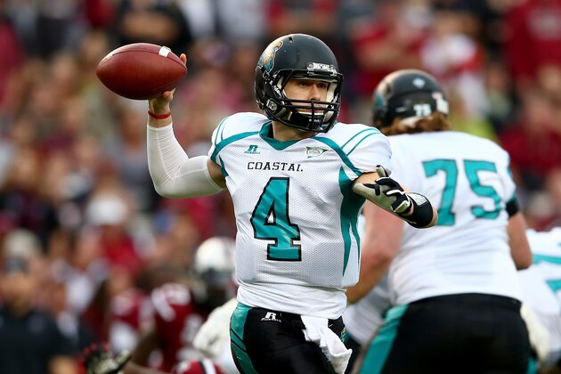 COLUMBIA, SC - NOVEMBER 23:  Alex Ross #4 of the Coastal Carolina Chanticleers drops back to pass during their game against the South Carolina Gamecocks at Williams-Brice Stadium on November 23, 2013 in Columbia, South Carolina.  (Photo by Streeter Lecka/Getty Images)