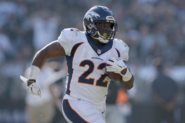 OAKLAND, CA - NOVEMBER 09:  C.J. Anderson #22 of the Denver Broncos carries for a touchdown in the first half against the Oakland Raiders at O.co Coliseum on November 9, 2014 in Oakland, California.  (Photo by Ezra Shaw/Getty Images)